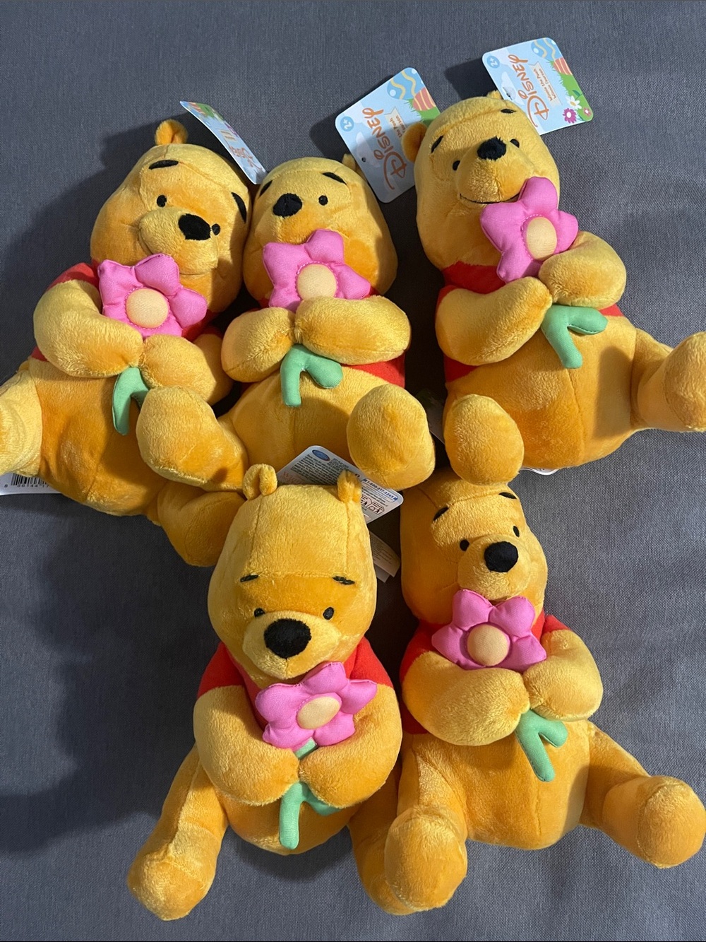 Disney Yellow Winnie the Pooh Plush Holding Pink Flower